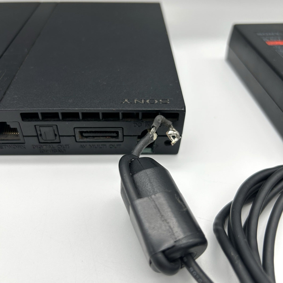 PS2 Slim SCPH-70004 + alimentatore – per ricambi / riparazione